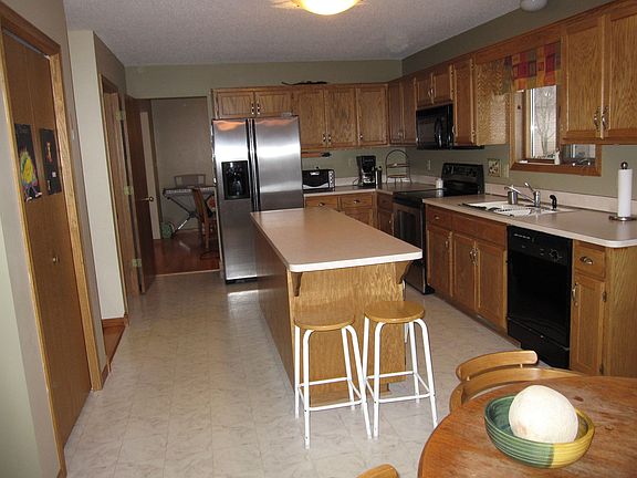 Great kitchen featuring an island work station with a lunch bar.