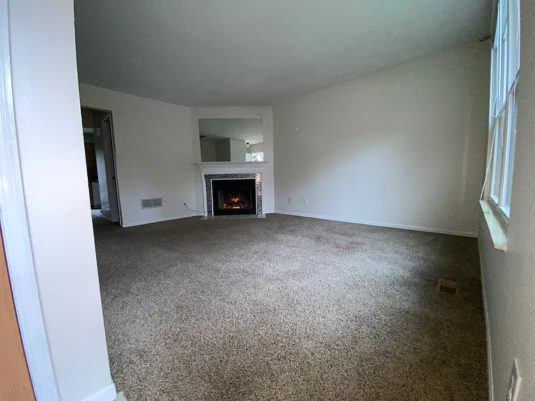 Front living room. Ornamental fireplace