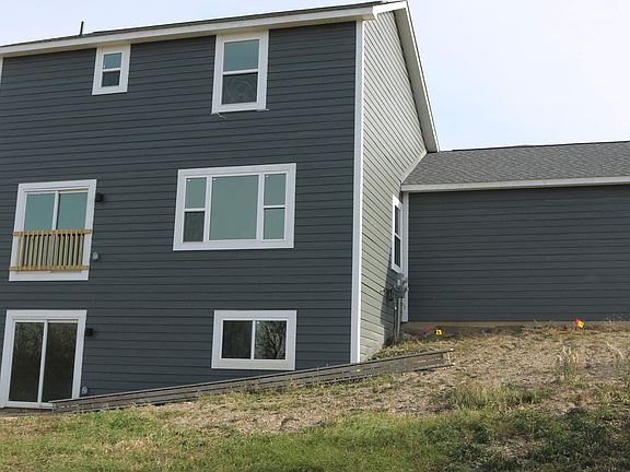 Stone and wood style siding.