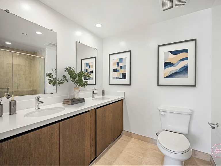 Primary Bathroom with a Double-Sink Vanity, Cabinet Storage, and Large-Size Shower - Eagle Floor Plan