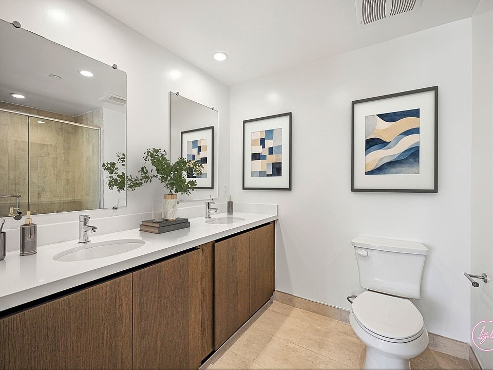 Primary Bathroom with a Double-Sink Vanity, Cabinet Storage, and Large-Size Shower - Eagle Floor Plan