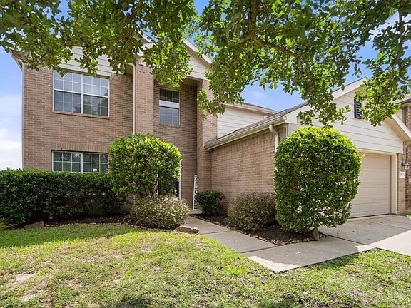 Fresh landscaping surrounds the home giving it an adorable curb appeal!