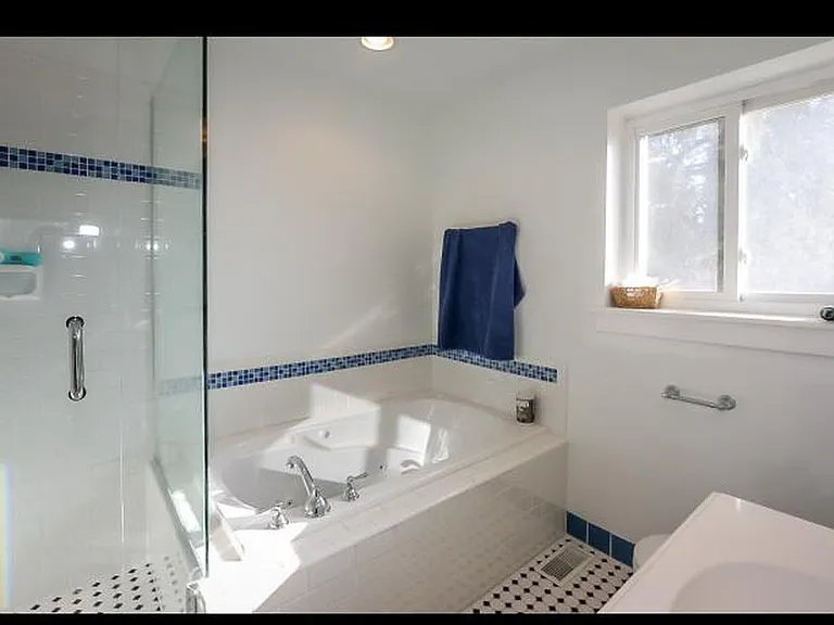 Bathroom off kids room with jetted tub
