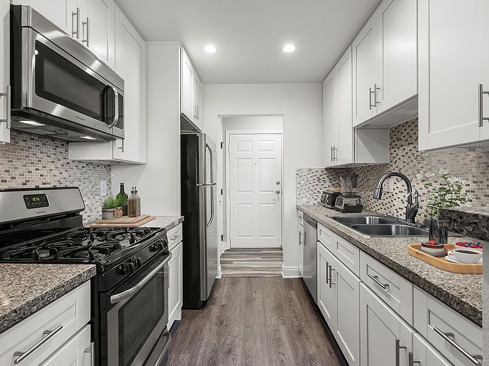 Brand new kitchen cabinets, back splash, quartz stone counter tops, and stainless steel appliances with fridge!