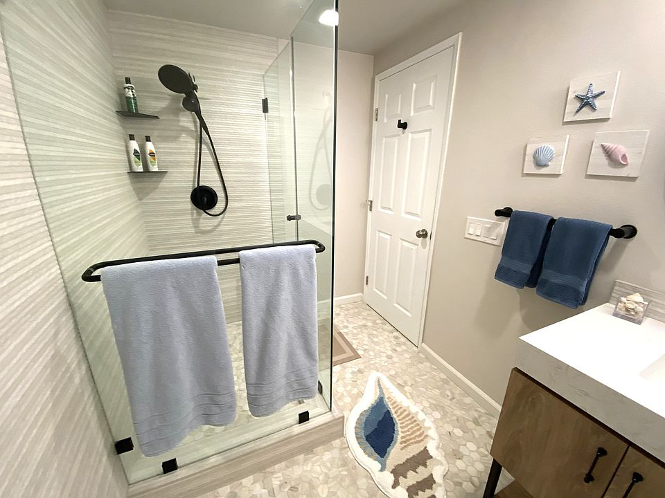 dual shower heads and three towels racks