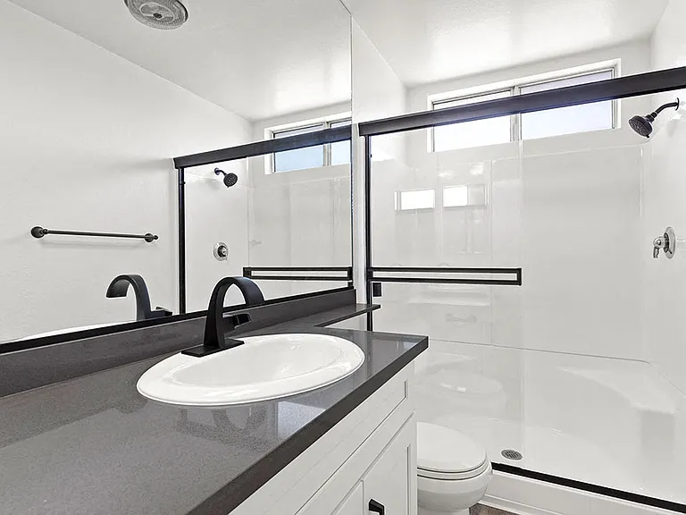 Modern styled bathroom with shower and tub.