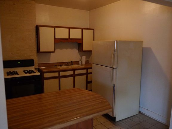 Kitchen of similar unit; but unit 3's kitchen is galley-style