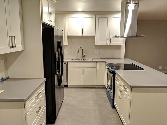 Open concept kitchen with new counters and cabinets