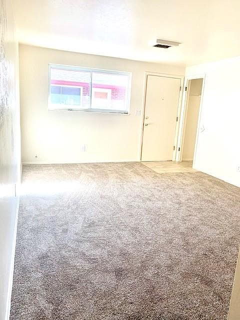 front entry with coat closet and living room