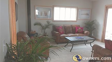 Living Rm. 14' x 15'.  Dbl. patio door to new deck. Wood stove.