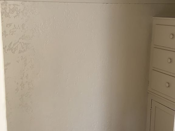 Walk-in closet with built in vanity off of the great-room.