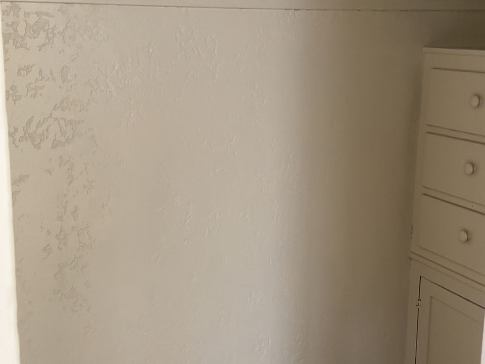 Walk-in closet with built in vanity off of the great-room.