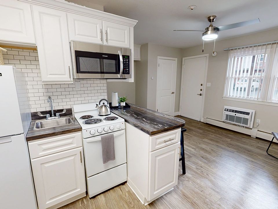 Enjoy the daily charm of our stylish modern kitchen with abundant cabinet space and a cozy breakfast bar.