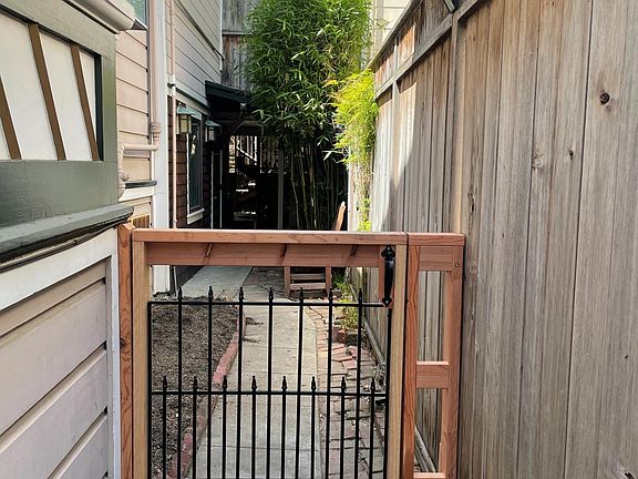 This is the walkway on the right side of the main house and walking toward the apartment.