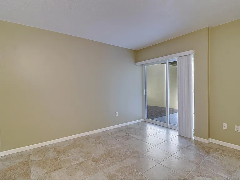 Bedroom has glass doors which open to private waterfront patio