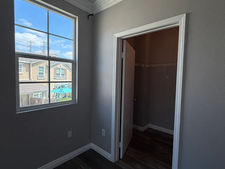 Large walk-in closet in primary bedroom.