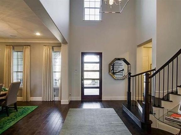 View of entry with gorgeous door that pours in lots of natur