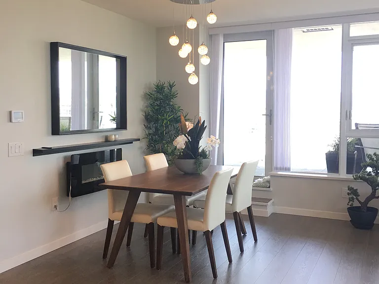 Dining room with electric fireplace, opens up to the terrace.