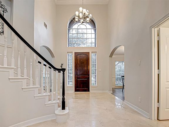 Two story entryway with Travertine flooring