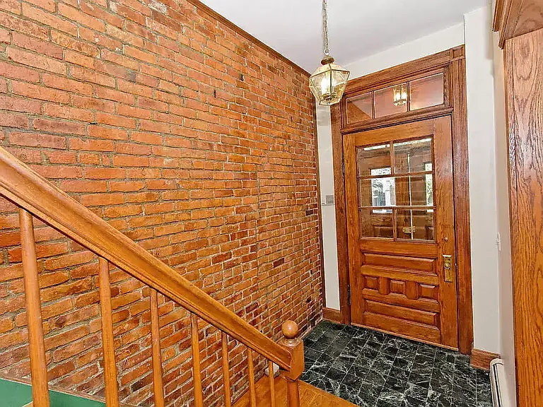 Walk inside and you see a sweet brick wall.