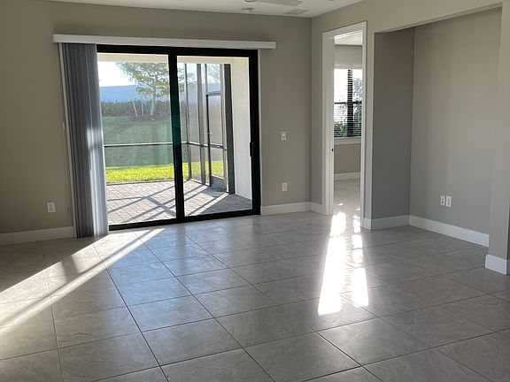 GATHERING ROOM WITH SLIDERS TO COVERED LANAI