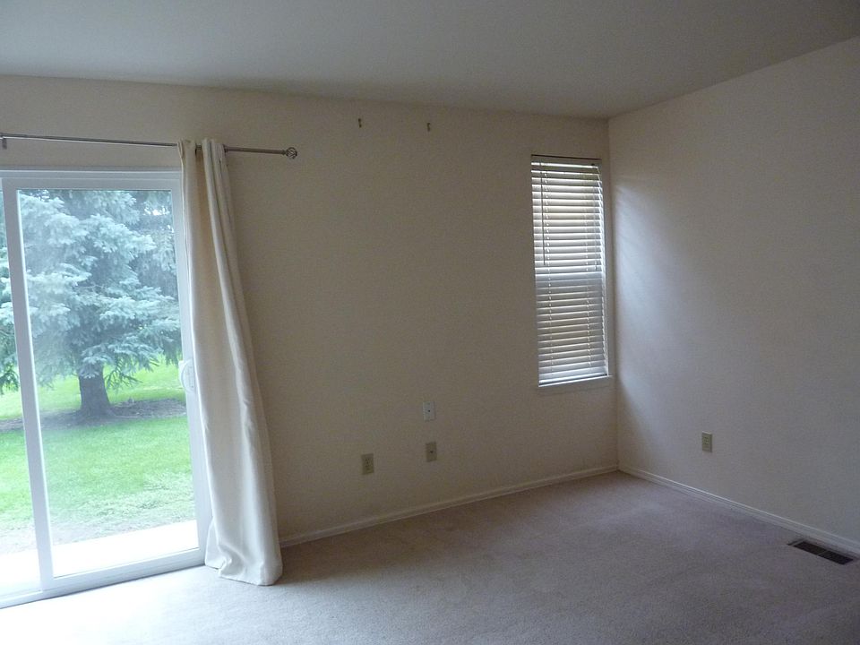 Living Room opening to patio and green space