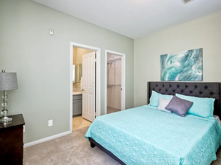 First floor bedroom with walk-in closet and ensuite bathroom