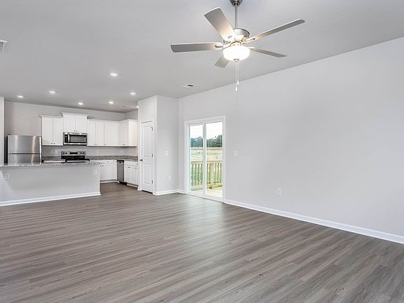 The living room is open to the kitchen