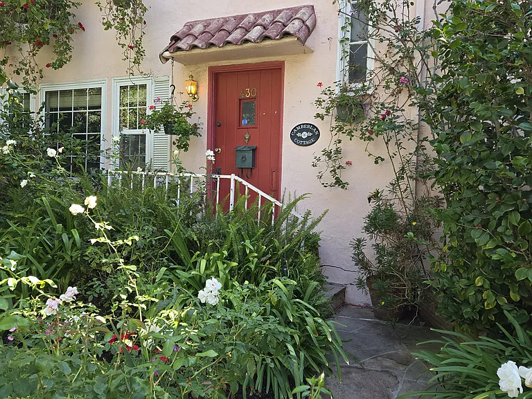 Enterance to the charming duplex unit. Faces west for morning shade and afternoon sun.