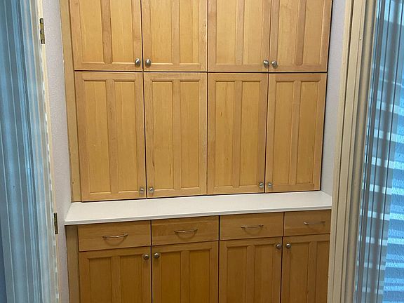 Second closet with lots of cabinetry and drawer storage.