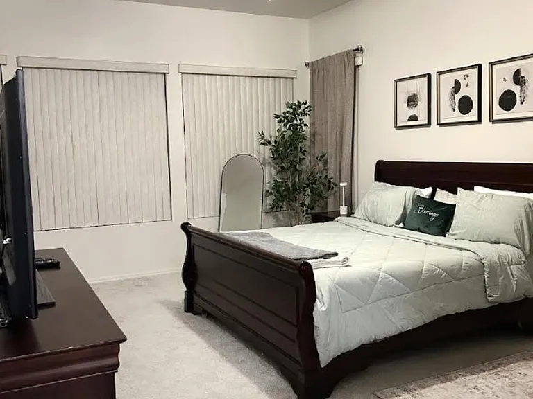 Extra large primary bedroom, equipped with comfy king size bed, serene reading nook, extra large windows.