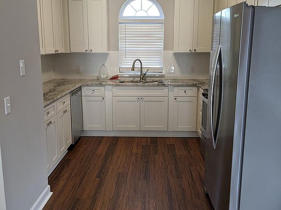 This beautiful open-concept kitchen opens up to a large living space.