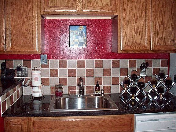 New stainless kitchen sink, Kohler faucet.