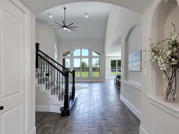 Wood-look tile throughout the main living areas on the first floor. Several art niches for displaying your fine collections.