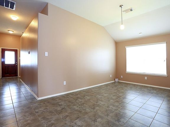 View of the light and bright formal dining room and hallway that you walk through as you enter the f