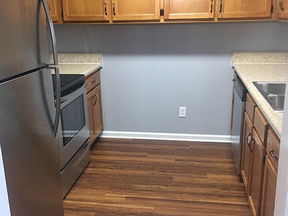 Modern kitchen including new appliances, flooring and countertops.