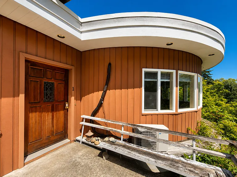 This is the door that leads in to the entryway. To maintain privacy, the owner asks that you use the private entrance below for you and your guests, although you are permitted to use the large deck area to enjoy the view of the gardens.