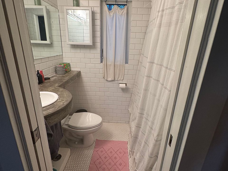 Modern bathroom with tub shower.