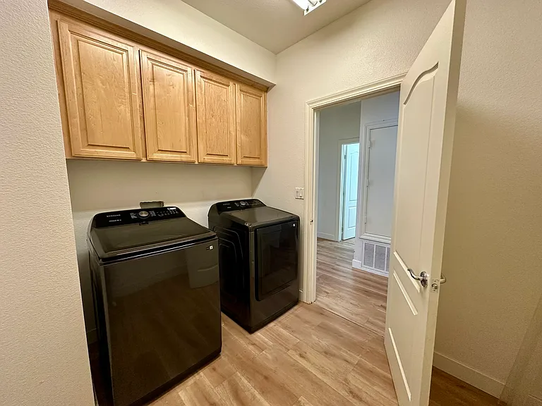 Upstairs:
Laundry Room with brand new washer/dryer and storage