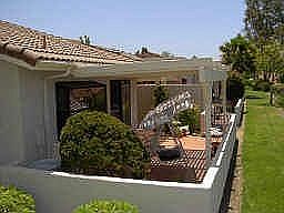 Private covered patio w/southwesterly facing views.