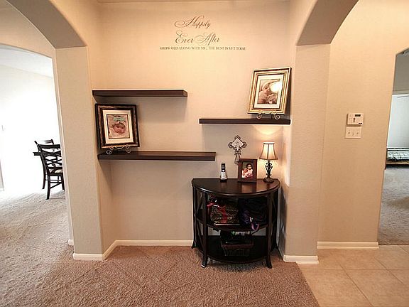 Another view of entrance with tray-ceiling too
