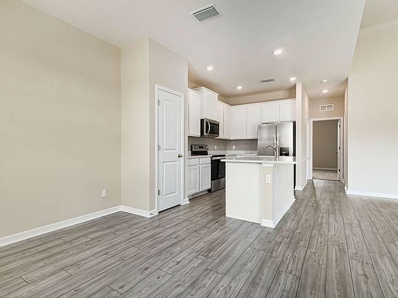 The beautiful, upgraded kitchen comes with stunning upgrades, including quartz countertops and