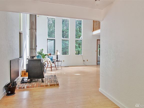 Plenty of light in this space! Laminate floors throughout living room.