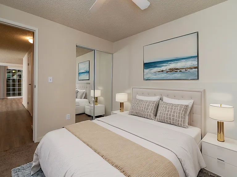Experience tranquility in this beautifully designed bedroom, complete with modern amenities and a warm ambiance.