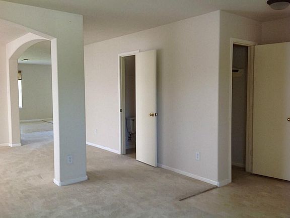 FROM ENTRY WAY - TO RIGHT IS GUEST/WINTER COAT CLOSET - TO LEFT IS THE HALF BATH - BEYOND THE COLUMN IS THE KITCHEN, BREAKFST ROOM, & DEN