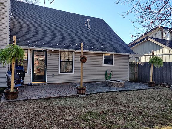 Back of the house with fire pit