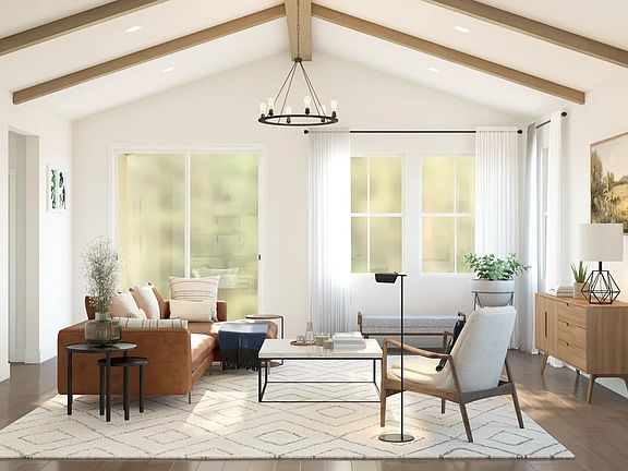 Great room with stained ceiling beams and vaulted ceiling