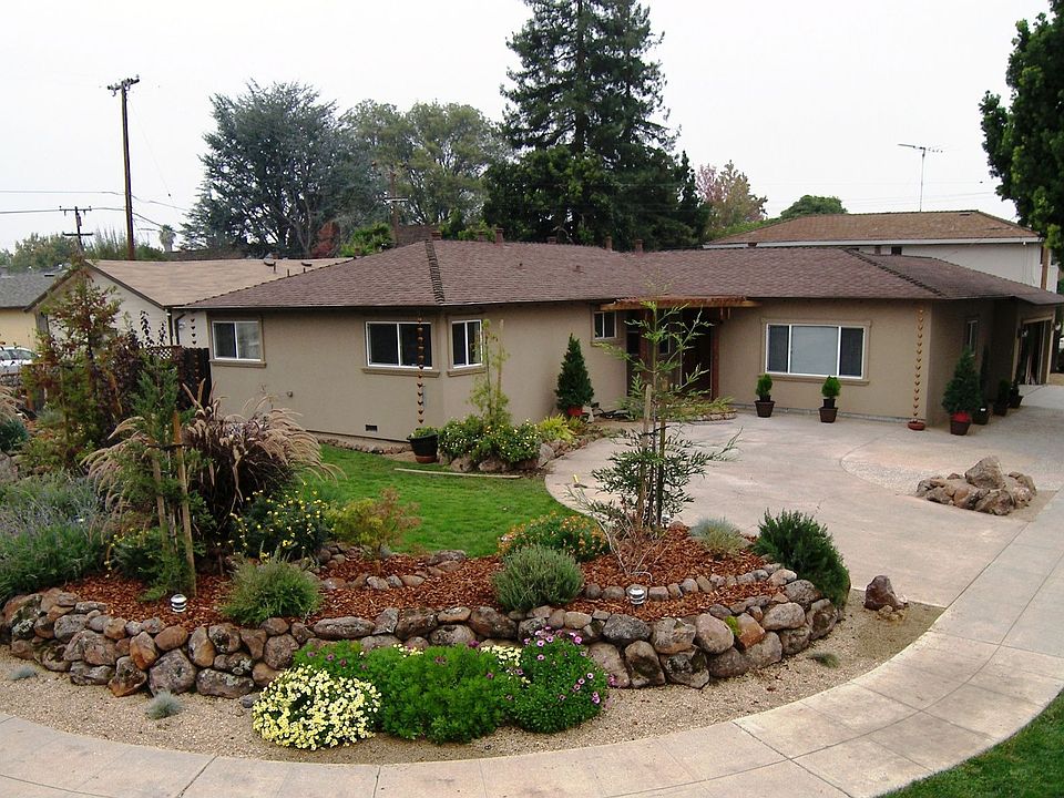 Large professionally landscaped corner lot