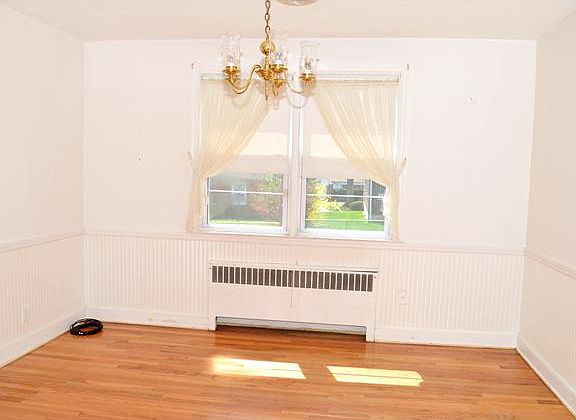 Formal dining room with chair rail trim.