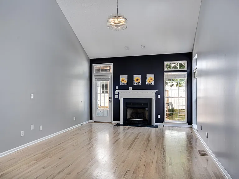 Great room with new hardwood floors and accent wall